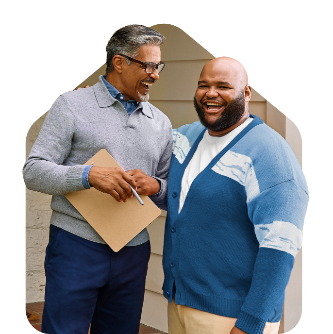 two men standing in front of a door
