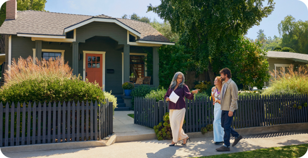 image of three people walking down the sidewalk