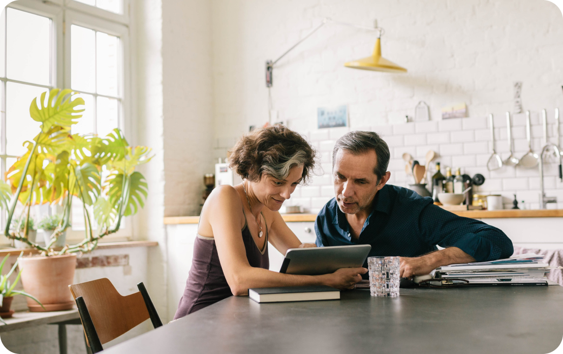 couple looking at tablet